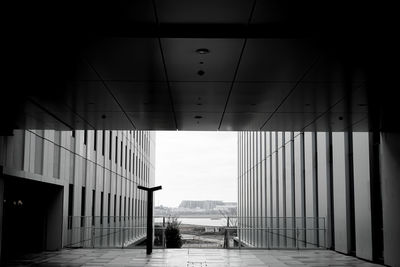 Rear view of man walking in tunnel