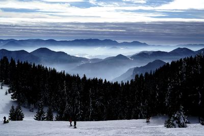 Scenic view of mountains against sky during winter