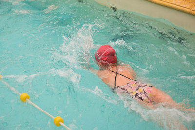 High angle view of person swimming in pool