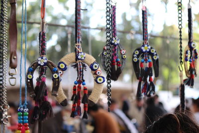 Close-up of decorations hanging at market stall