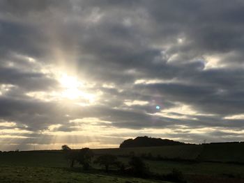 Scenic view of landscape against cloudy sky