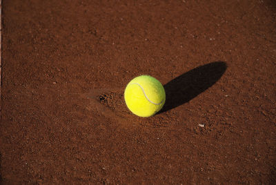 Close-up of yellow ball on field