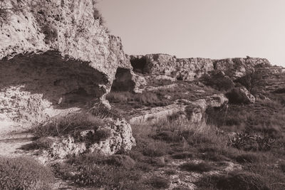 Rock formation on land against sky