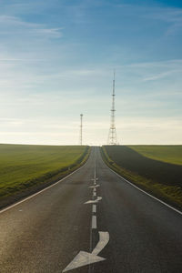 Country road against sky