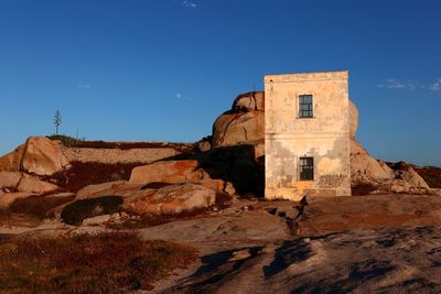 Low angle view of historical building against blue sky