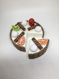 High angle view of birthday cake against white background