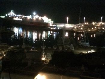 Illuminated ferris wheel at night