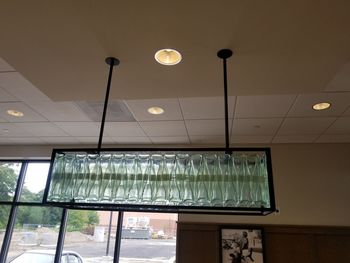 Low angle view of illuminated pendant lights