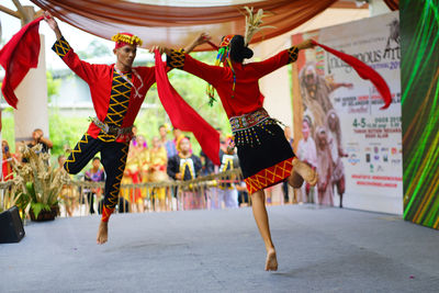Group of people dancing at concert