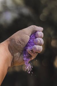 Close-up of hand holding powder paint
