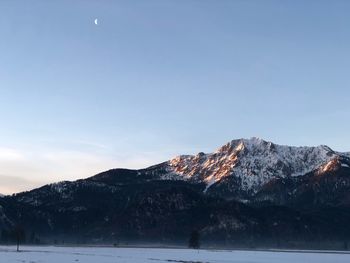 Scenic view of snowcapped mountains against sky during winter