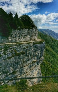 Scenic view of mountain against cloudy sky