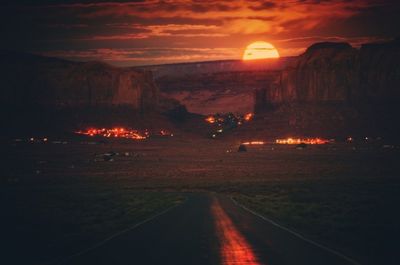 Scenic view of road against dramatic sky