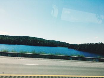 Scenic view of lake against blue sky