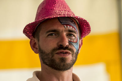 Close-up portrait of mid adult man