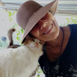 Portrait of woman with cat