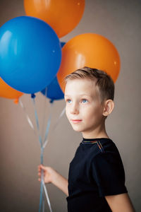 Portrait of boy with balloons