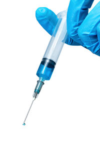 Low angle view of hand against white background