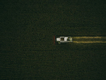 Aerial view of machinery working in agricultural field