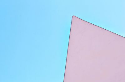 Low angle view of building against blue sky