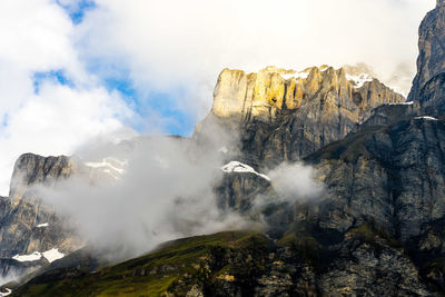 Scenic view of waterfall against sky