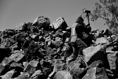 Low angle view of rocks against clear sky