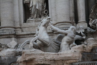 Low angle view of statue against building