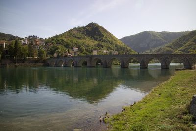 Bridge over river against sky