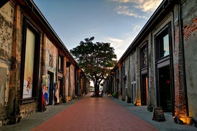 Street amidst buildings against sky