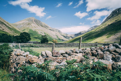 Scenic view of landscape and mountains against sky