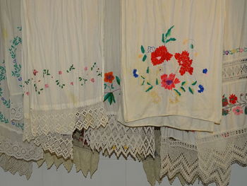 Close-up of white curtain hanging at home