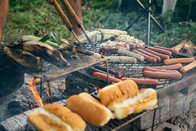 Close-up of preparing food on barbecue grill