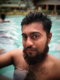 Portrait of young man in swimming pool