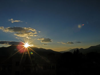 Scenic view of silhouette mountains against sky during sunset