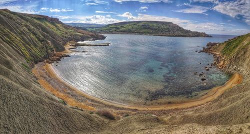 High angle view of sea shore against sky