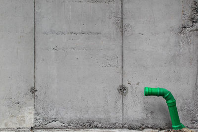 Blue pipe on wall