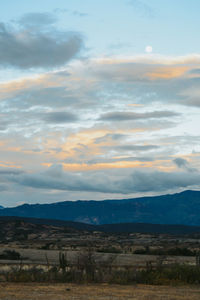 Scenic view of field against sky during sunset