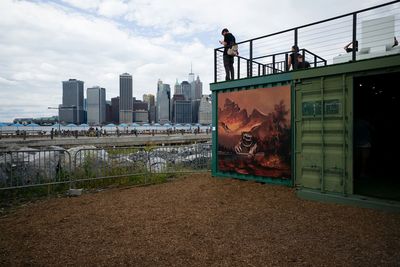 People at brooklyn against sky