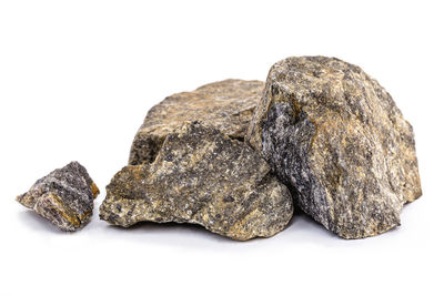 Close-up of stones against white background