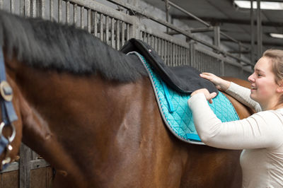 Midsection of man in stable