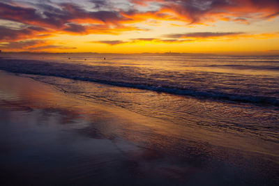 Scenic view of beach against sky during sunset