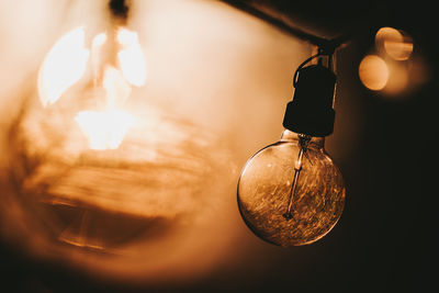 Close-up of illuminated light bulb