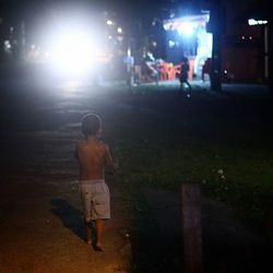 Woman standing at night