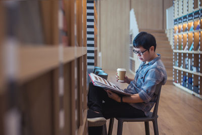 Side view of senior man using laptop