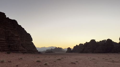 Scenic view of rocky mountains against clear sky