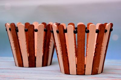 Close-up of wooden table against sea