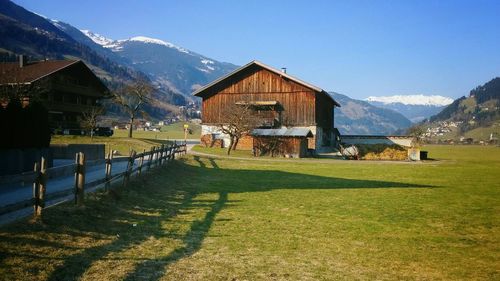 Scenic view of grassy field against sky