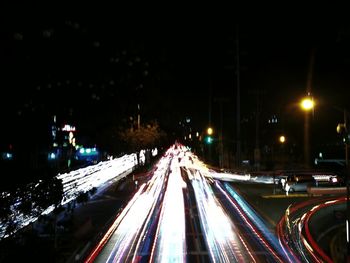 High angle view of light trails on city street at night