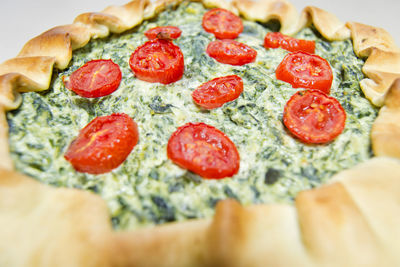 Vegetarian salad cake with fillo pastry, spinach, ricotta cheese and tomatoes