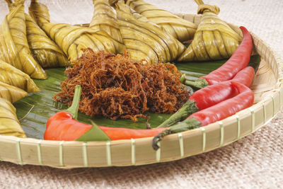 High angle view of vegetables in basket on table